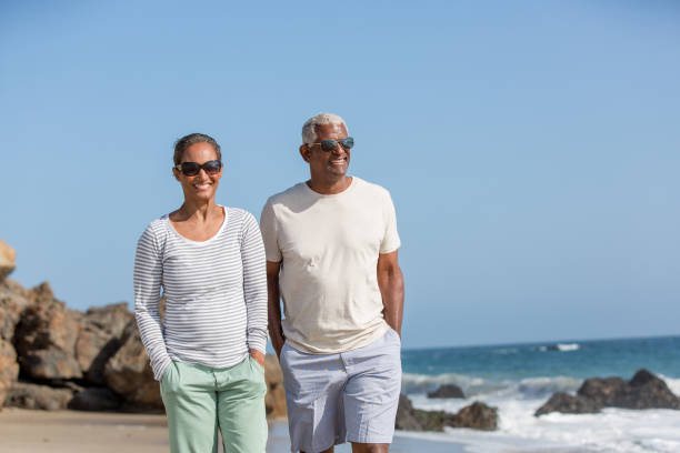 istock Happy Senior Couple Bonding on Santa Monica Beach 921976992