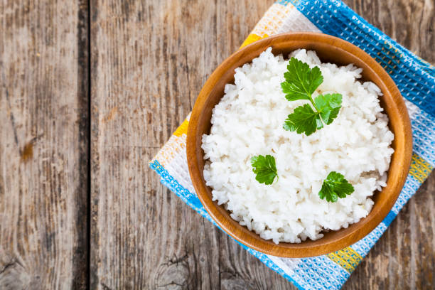 istock Boiled rice in a wooden bowl 921980182