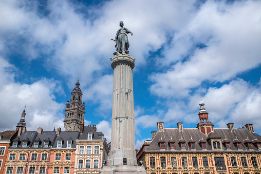 View in Grand Place in the historical city of Lille, France. The view includes the Column of the Goddess, Vieille Bourse, and the Chamber of Commerce and Industry.
