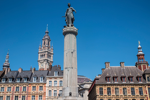 View in Grand Place in the historical city of Lille, France. The view includes the Column of the Goddess, Vieille Bourse, and the Chamber of Commerce and Industry.