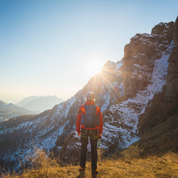 istock Mountaineer enjoying sunrise mountains view 921984374