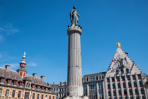 A view of the Column of the Goddess, Vieille Bourse and La Voix du Nord headquarters situated in Grand Place in the historic city of Lille, France.