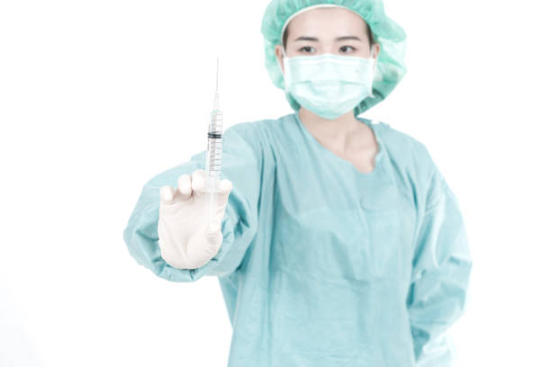 istock Female surgeon at work in white background 921984852