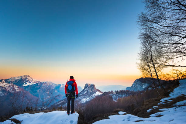 istock Hiker looking the mountains view at sunrise 921987086