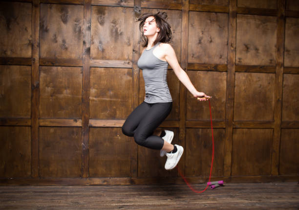 istock Girl jumping on skipping rope 921996412