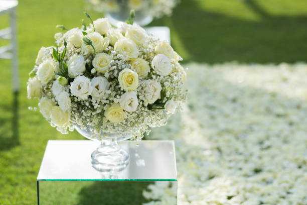 istock White rose flower bouquet decoration setup on wedding ceremony 921997798