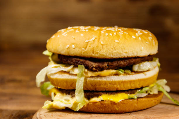 istock Delicious big hamburger on wooden table 922000846
