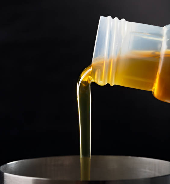 istock Pouring synthetic oils for car engine on a dark background. 922001202