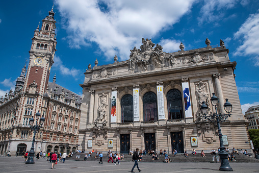 LILLE, FRANCE - JUNE 26TH 2017: A view of the magnificent Opera de Lille opera house and the Chamber of Commerce and Industry situated in Place du Theatre in Lille, France, on 26th June 2017.