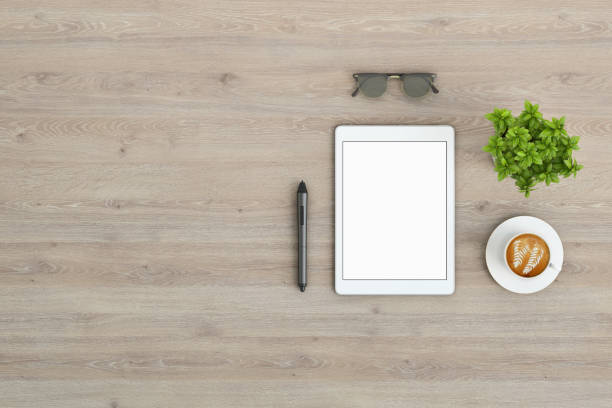 istock Knolling top view of office desk with blank tablet 922004254