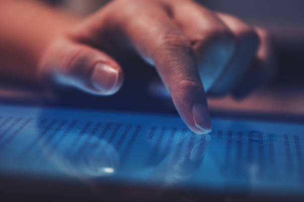 istock Extreme close up of female finger using digital tablet 922006866