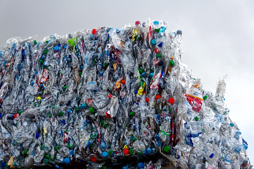 detail of a heap of compressed plastic bootles waiting for recycling