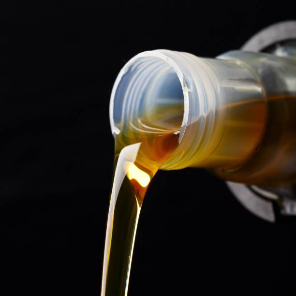 istock Pouring synthetic oils for car engine on a dark background. 922006902