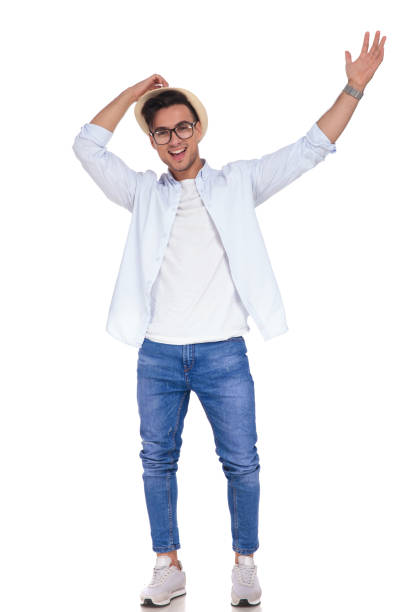 istock excited young casual man with hands up celebrating success 922010812