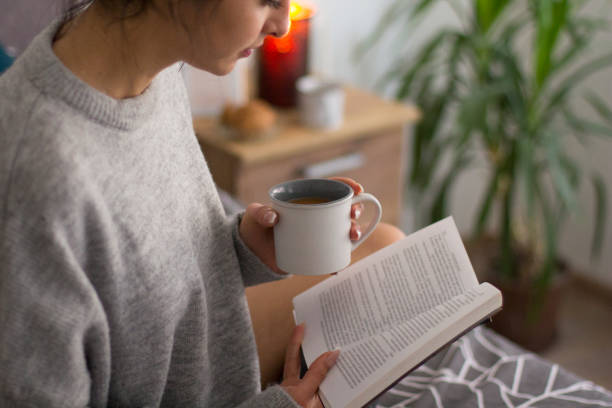 istock Enjoying a good book and coffe in bed 922010856