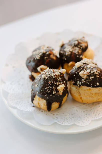 istock Small dessert cakes with chocolate on the top. 922010876