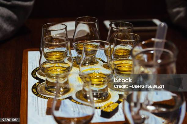 A Whisky Tasting Flight Of Six Glasses On A Table Stock Photo - Download Image Now - Whiskey, Tasting, Scotland