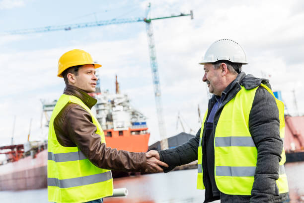 istock Business handshake in a shipyard. Shipbuilding industry 922012156