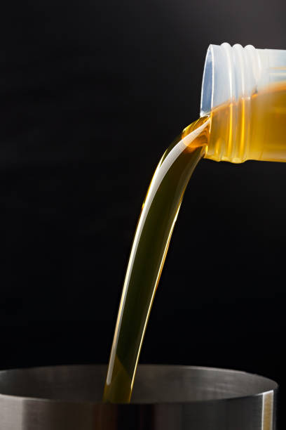 istock Pouring synthetic oils for car engine on a dark background. 922017798