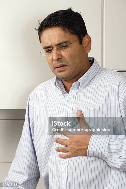 Heartburn Pain Stock Photo - Download Image Now - Heart Attack, Indian Ethnicity, 30-39 Years
