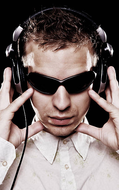istock handsome dj in sunglasses with headphones 92202420