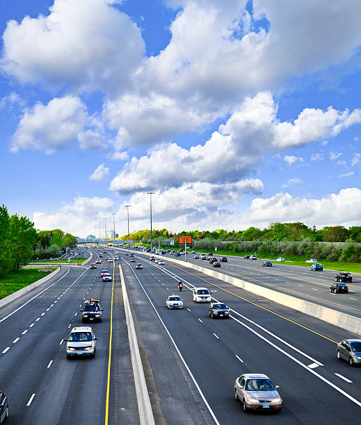 istock Wide multilane road with light traffic on a sunny day 92202462