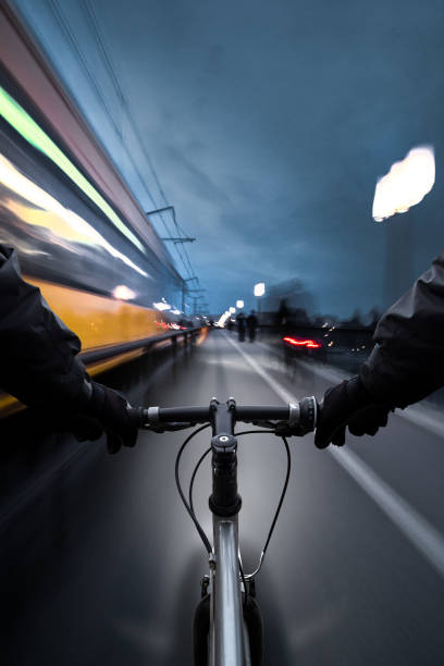 istock Cyclist and tram ride side by side 922028788