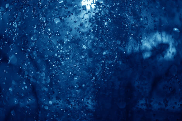 istock blue spray fountain at night 922033448