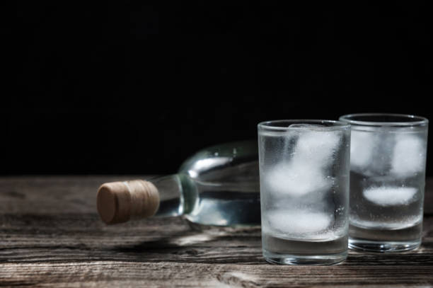 istock Cold vodka in shot glasses on a black background 922033836