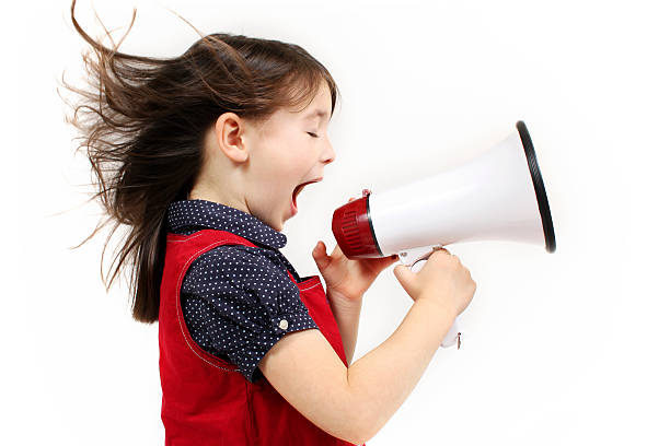 istock Young girl shouting over a megaphone 92203404