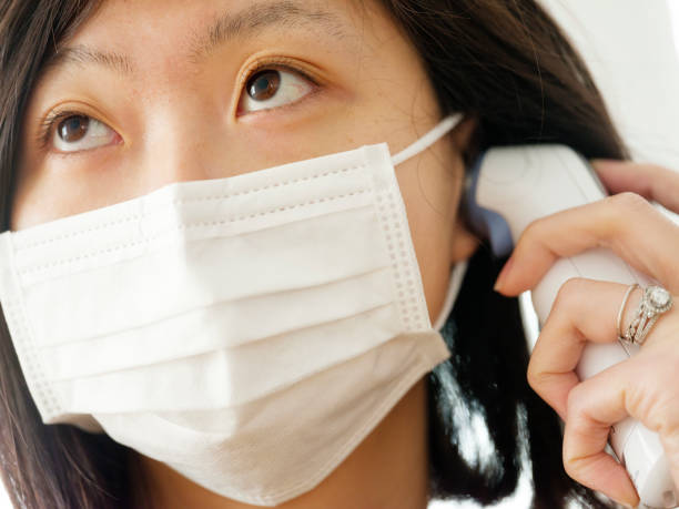 istock A Japanese woman checking the body temperature 922036066