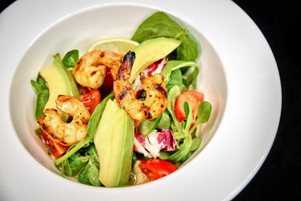 istock Green salad with shrimp and avocado 922038374
