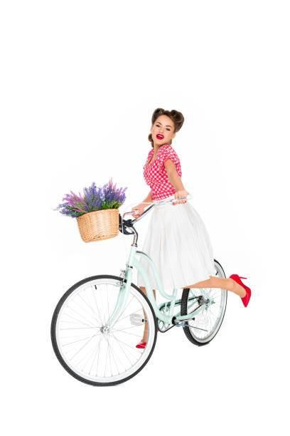 istock attractive pin up woman on retro bicycle isolated on white 922044870