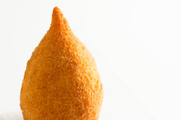 istock Coxinha is a deep fried food, traditional in Brazil. One snack on white background. Selective focus, minimalism. 922047090