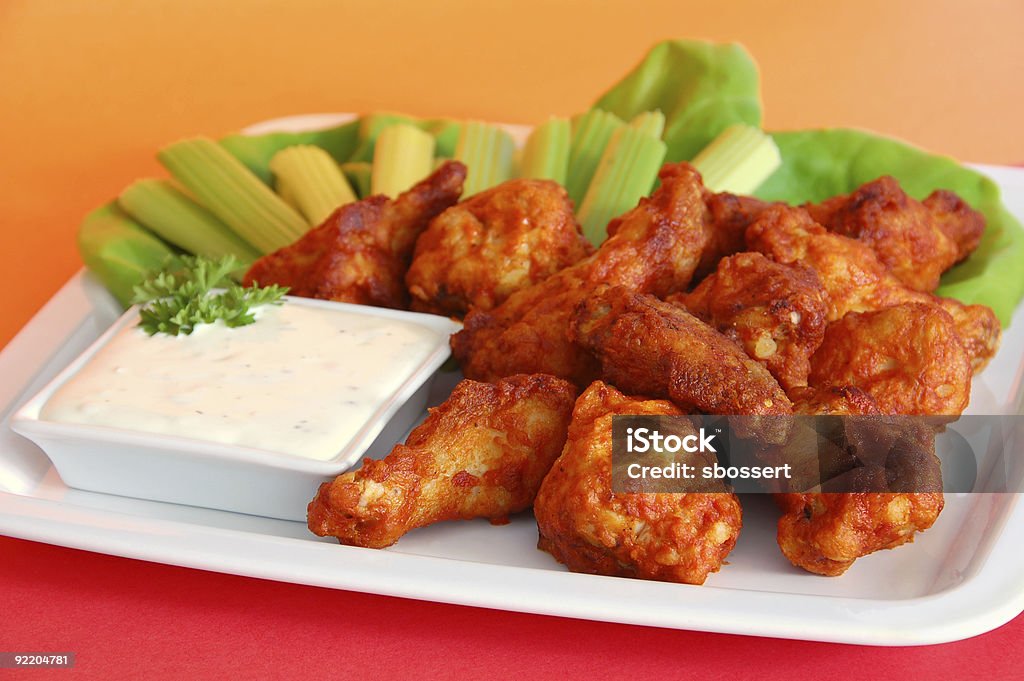 Hot Spicy Buffalo Wings Extra Spicy Buffalo Wings, served with celery sticks and blue cheese dip. Animal Body Part Stock Photo