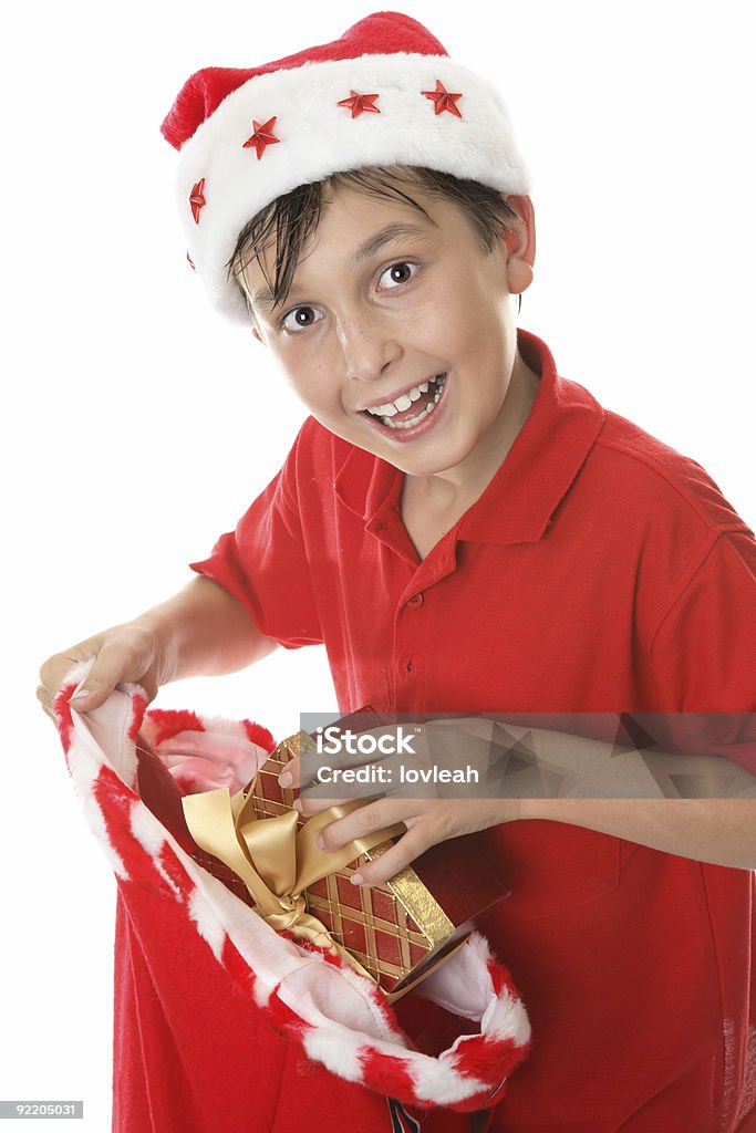 Enfant avec un sac de cadeaux - Photo de Blanc libre de droits