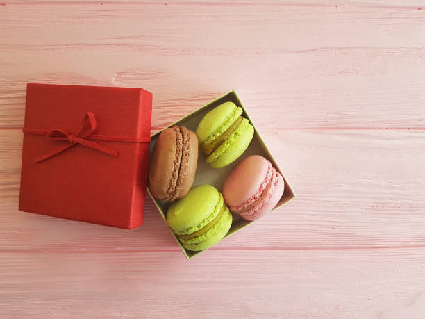 istock macaroon on a pink wooden, rose flower 922058808