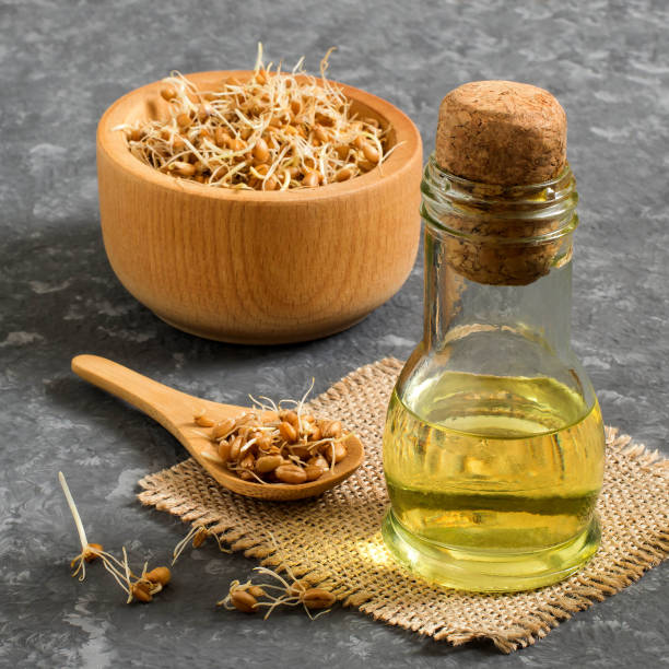 istock Fresh sprouted wheat seeds and wheat germ oil 922060940