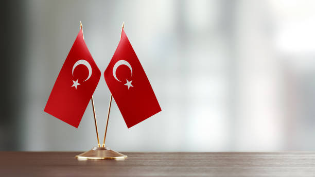istock Turkish Flag Pair On A Desk Over Defocused Background 922063344