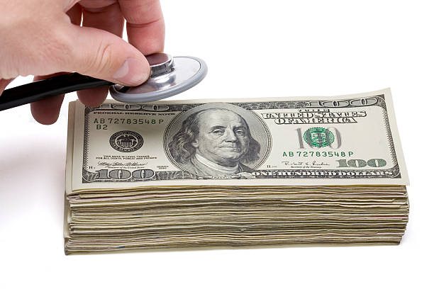 Financial Health; Money and Stethoscope stock photo