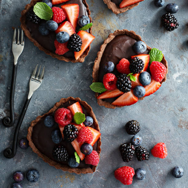 istock Chocolate ganache tarts with fresh berries 922064220