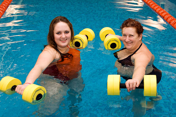 istock Mum with a daughter in aqua aerobics 92206504