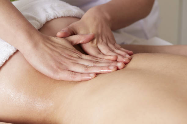 istock Female Enjoying Relaxing Back Massage In Cosmetology Spa Center 922066768