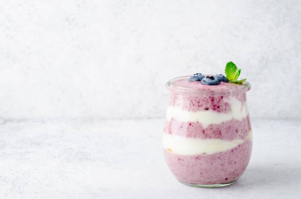 istock Acai berry yogurt in glass jars 922066908