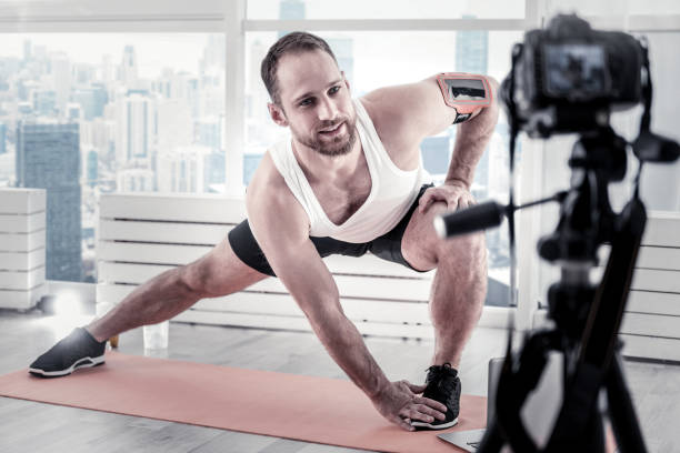 istock Inspired male blogger reaching out toe 922066978