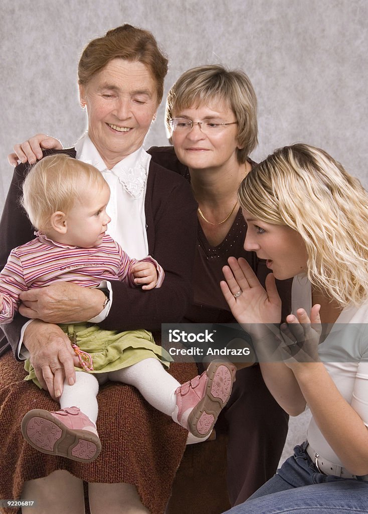 Quattro generazioni - Foto stock royalty-free di Abbracciare una persona
