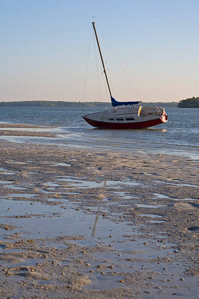 istock Sailboat On Its Side Caught by Low Tide 92206883