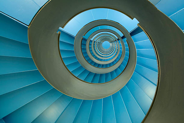 Spiral staircase with endless blue facets  eternity stock pictures, royalty-free photos & images