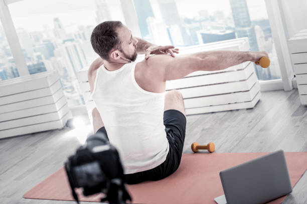 istock Energetic male blogger showing progress 922072200