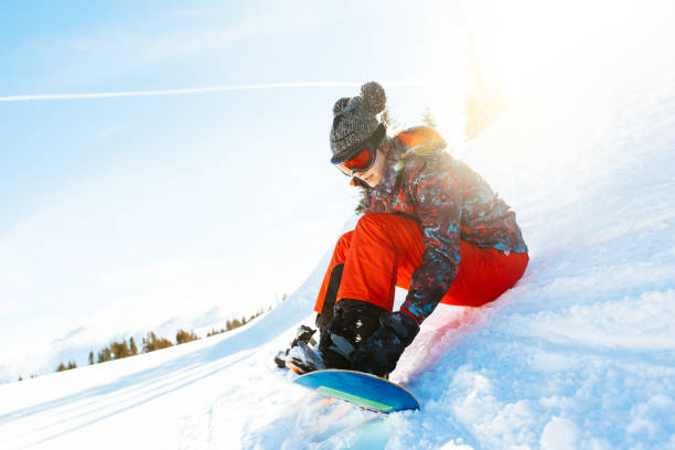 istock female snowboarder having fun on ski track 922072202